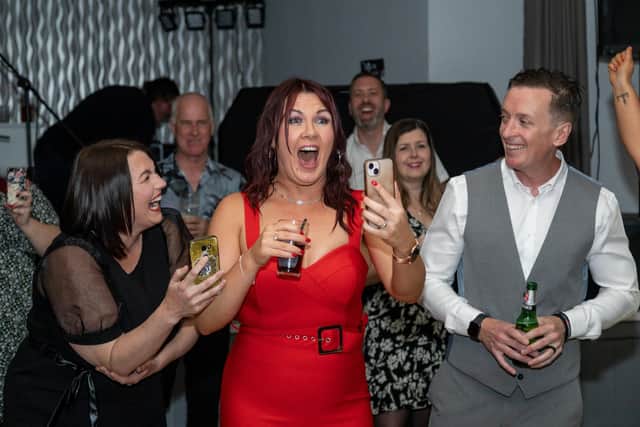 Surprise as the prankster is revealed. Pictured: Becky O'Nion, Leanne Conroy and husband Andy Conroy. Picture: Mike Cooter (150423)