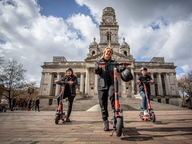 The e-scooter rental trial launched in Portsmouth last week.

Pictured: Voi scooter team, Jon Hamer, Maria Sassetti and Nikolina Kotur on the e-scooters at Portsmouth Guildhall walk on 15 March 2021.
Picture: Habibur Rahman