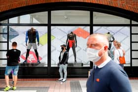 Face masks will have to be worn in shops from November 30. Picture: ADRIAN DENNIS/AFP via Getty Images