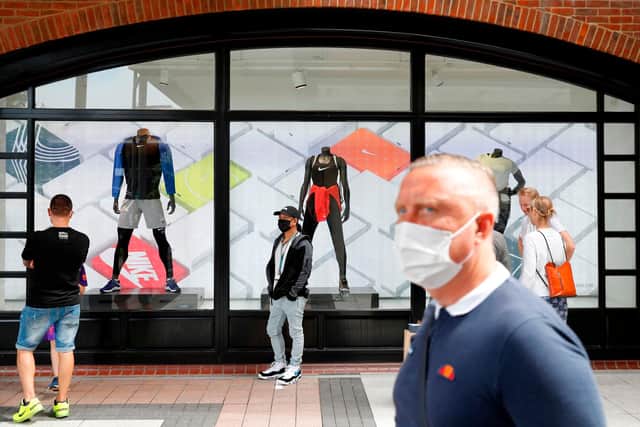 Face masks will have to be worn in shops from November 30. Picture: ADRIAN DENNIS/AFP via Getty Images