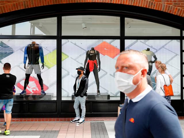 Face masks will have to be worn in shops from November 30. Picture: ADRIAN DENNIS/AFP via Getty Images
