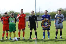 Baffins Milton Rovers Reserves captain Morgan Moret with a wreath in memory of Mason Peddle. Picture: Chris Moorhouse