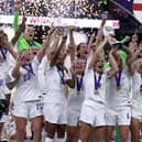 England players celebrate with the trophy following victory over Germany in the UEFA Women's Euro 2022 final at Wembley Stadium, London. Picture date: Sunday July 31, 2022.