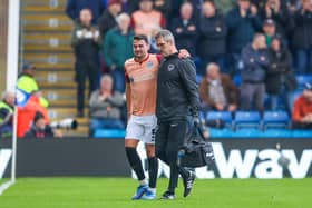 Regan Poole was forced off in the 11th minute at Chesterfield after sustaining a twisted knee. Picture: Simon Davies/ProSportsImages