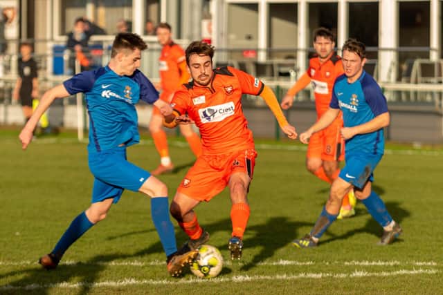 Tommy Tierney, left, grabbed a dramatic late Wessex League Cup winner for Baffins at Brockenhurst. Picture: Vernon Nash