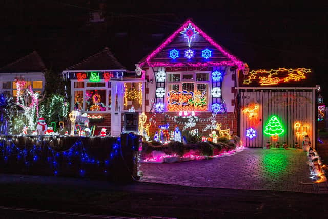 Barbara and Bill Wright have decorated their home with Christmas lights once again despite the cost of living crises to raise money for charity 

Pictured: GV of the Christmas lights at their home in Portchester, Portsmouth on Monday 12th December 2022

Picture: Habibur Rahman