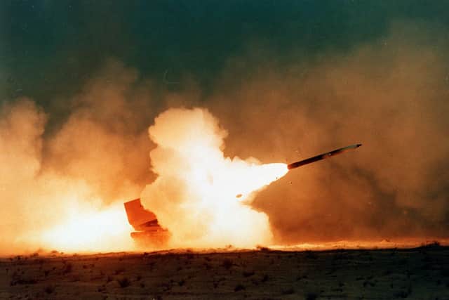 A rocket is launched in the Saudi Desert during the Gulf War, amid the backdrop of the oil fire-fuelled black sky. Picture: Mike Moore/Today/PA Wire