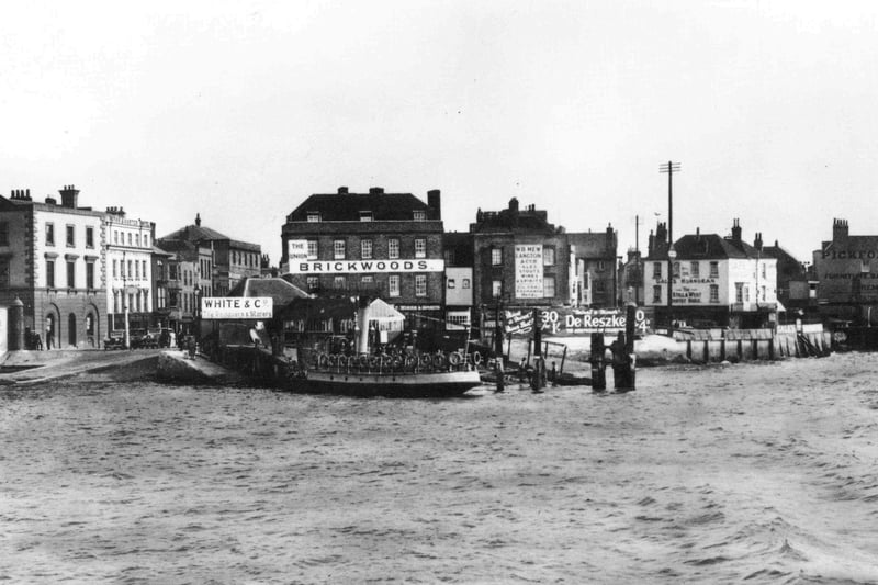 Point Old Portsmouth.
Sent in by K. Gill of Alexander Road, Landport, we see what is always termed these days as 'Spice Island' by the tourist bods.
This is a much changed scene with all the buildings to the left demolished. The Brickwoods pub  The Union  is now called The Spice Island Inn although the white building to the right, the Gales owned Still and West still operates under the same name.
In the centre, Mew Langton were a brewers located at 83, High Street.
To the left can be seen the railway owned car ferry to the Isle of Wight. The notice states: Southern Railway Motor Car Ferry Service - Portsmouth to Fishbourne