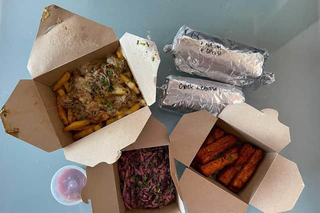 Dish Detective's haul from Los Dos Amigos - two burritos, loaded fries, halloumi fries and homemade coleslaw.