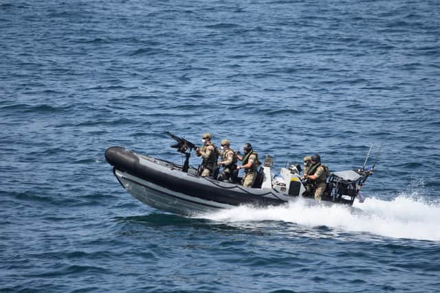 HMS Montrose's Royal Marines boarding team approach a suspicious dhow while operating as part of Combined Maritime Forces (CMF) counter-narcotics operations in the Gulf. Photo: Royal Navy