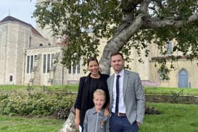 The Queen's funeral is being screened at St Mary's church on Monday 19th September 2022 Pictured: Nicole and Nathan Geddis with son Jack Geddis outside Portsmouth Cathedral.