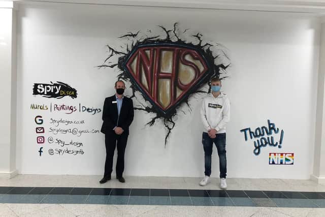 Artist Keaton Spry with his Fareham Shopping Centre NHS mural, pictured with centre manager Mike Taylor
