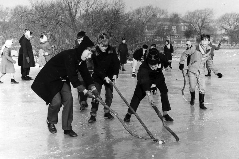 Eleven-year-old Lee Bryant (on the left with the hood) playing ice hockey on Baffins Pond, Baffins, Portsmouth, during the winter of 1963. The boys are playing with branches and a frozen lump of ice!