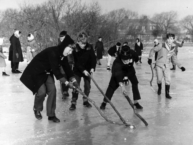Eleven-year-old Lee Bryant (on the left with the hood) playing ice hockey on Baffins Pond, Baffins, Portsmouth, during the winter of 1963. The boys are playing with branches and a frozen lump of ice!