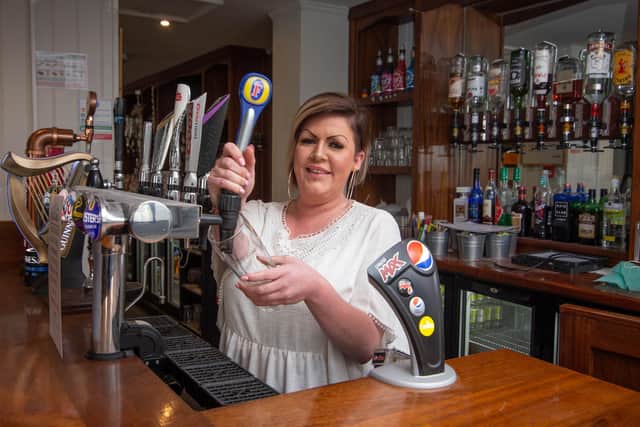 Kimberley Lattimer behind the bar at the Falcon in Waterlooville 
Picture: Habibur Rahman