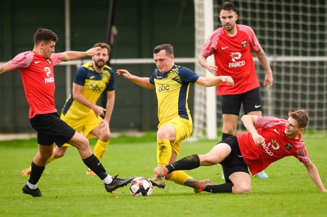 Moneyfields' Callum Glen (yellow) misses next Saturday's trip to Wessex League leaders AFC Portchester through suspension. Picture: Keith Woodland