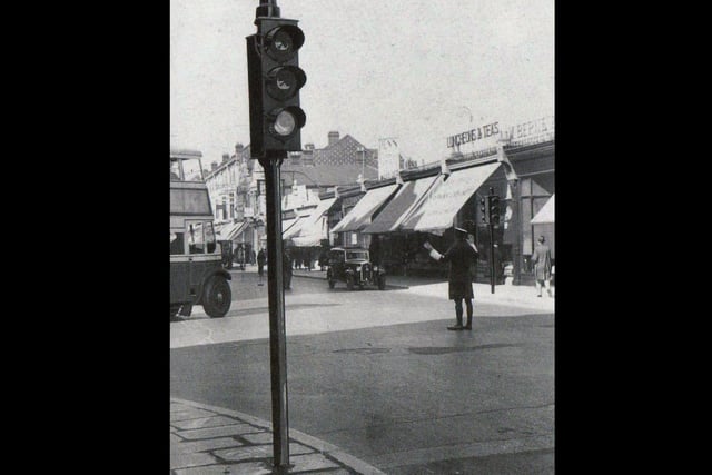 Portsmouth's first set of traffic lights on the corner of Elm Grove and Grove Road, Southsea, in 1933