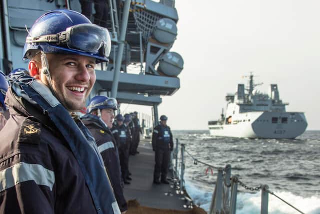 Pictured: The crew of HMS Lancaster including LET(CIS) Jack Feltham are all smiles as they prepare for a 'triple RAS' with RFA Tide Race in the Baltics.
Credit: LPhot Dan Rosenbaum, HMS Lancaster
