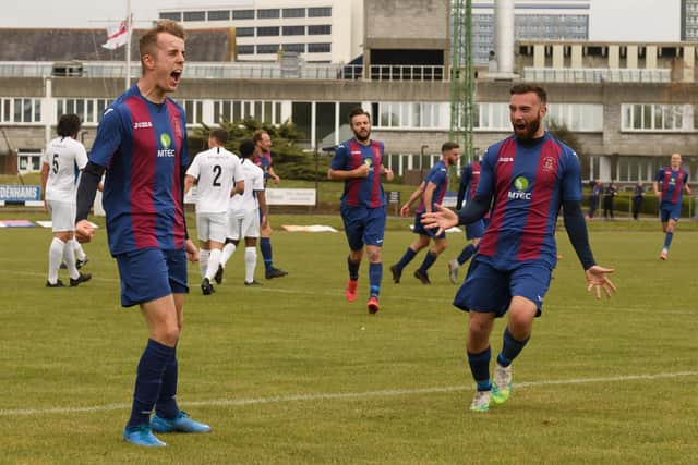 Josh Hazell (right) rushes in to congratulate James Franklyn on his goal. Picture: Keith Woodland