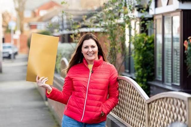People’s Postcode Lottery ambassador Judie McCourt congratulated the lucky winners in Southsea. Picture: People's Postcode Lottery