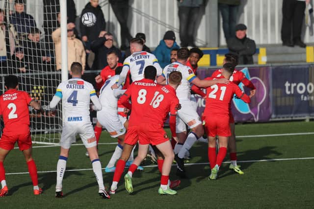Jake McCarthy (7) about to see his header cleared off the line. Picture by Dave Haines.
