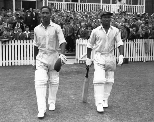 West Indies cricketers Everton Weekes, right, and Frank Worrell walk out to bat against England at Trent Bridge in 1950. Photo by Central Press/Getty Images.