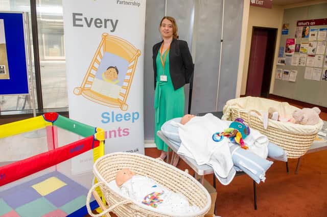 Launch of initiative to promote safe sleeping for babies and prevent suddeninfant death at Portsmouth Central Library, Portsmouth.
Pictured: Sam Smith, Learning and Improvement Co ordinator for Hampshire Safe Guarding Children Partnerships demonstrating the importance of how to position a baby when he or she sleeps.  
Picture: Habibur Rahman