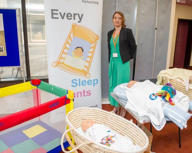 Launch of initiative to promote safe sleeping for babies and prevent suddeninfant death at Portsmouth Central Library, Portsmouth.
Pictured: Sam Smith, Learning and Improvement Co ordinator for Hampshire Safe Guarding Children Partnerships demonstrating the importance of how to position a baby when he or she sleeps.  
Picture: Habibur Rahman