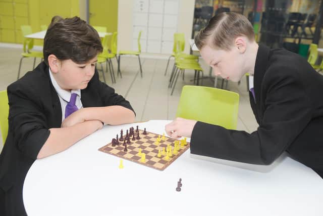 Representatives from the FatFace Foundation attended Havant Academy's daily breakfast club to celebrate its donation of £30,000 to the Magic Breakfast. The charity's contribution will pay for 100,000 breakfasts for schoolchildren across the nation who arrive at school too hungry to learn - starting in Havant. Picture are Mason McLauchlan, 12, and Lewis Crawford, 13. Picture: Sarah Standing (280220-9065)