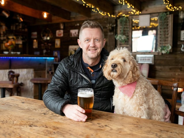 John Simmons with dog Bertie at his pub shed,