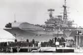 Falklands task force flagship HMS Hermes pulls away from her berth in Portsmouth Naval Base on April 5, 1982, bound for the South Atlantic.