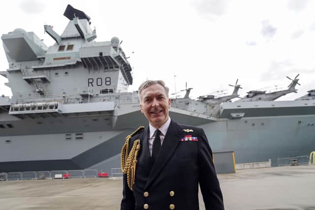 First Sea Lord Admiral Tony Radakin talks to. media in front of the HMS Queen Elizabeth at HM Naval Base, Portsmouth, ahead of the ship's maiden deployment to lead the UK Carrier Strike Group on a 28-week operational deployment travelling over 26,000 nautical miles from the Mediterranean to the Philippine Sea. Picture date: Saturday May 22, 2021.
