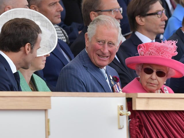 French President Emmanuel Macron, the then Prime Minister Theresa May, the then Prince Charles and Queen Elizabeth II attend an event to commemorate the 75th anniversary of the D-Day landings in Portsmouth on June 5, 2019