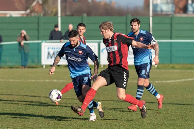 Simon Woods (red/black) was on target as Fareham collected a sixth successive Wessex League Premier Division win. Picture: Vernon Nash (230219-124)