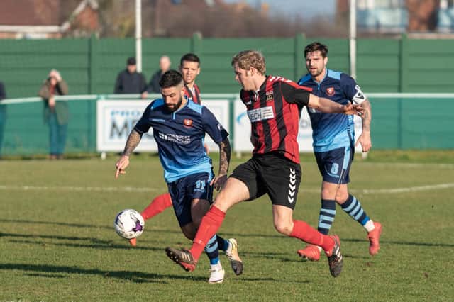 Simon Woods (red/black) was on target as Fareham collected a sixth successive Wessex League Premier Division win.  Picture: Vernon Nash (230219-124)