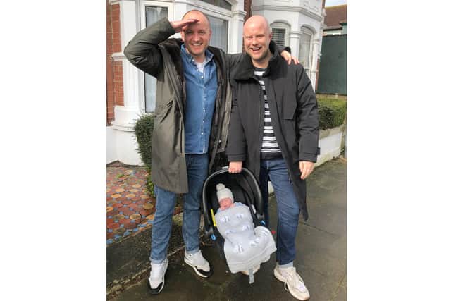 Scott, left, and Josh holding baby Ralph. Pictures: Joshua and Scott Turner-Griffiths.