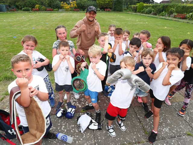 Mikey McKinson, furthest back, with some Heart of Hayling Boxing Academy youngsters. Picture: Stuart Martin (220421-7042)