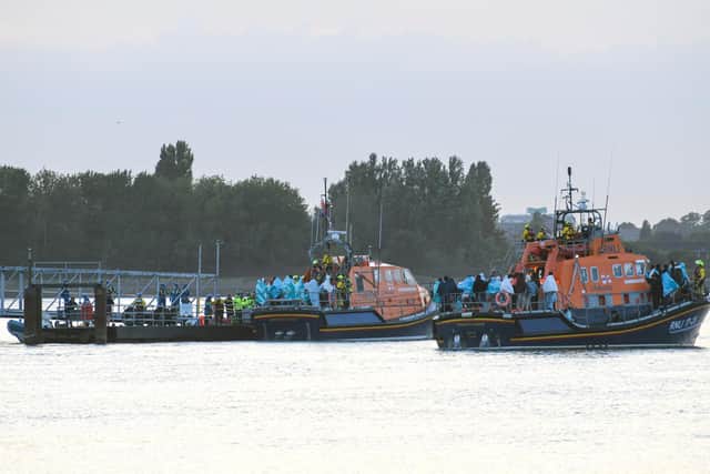 Around 140 migrants arrive in Portsmouth after being transferred from a single dingy south of the Isle of Wight in the English Channel by two RNLI lifeboats
