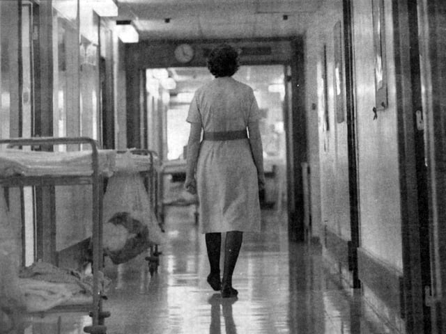 A nurse walking through the corridor in the 1999