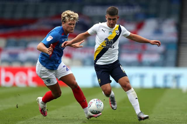 Cameron Brannagan and Pompey's Cameron McGeehan. Pic: Andrew Matthews/PA Wire.