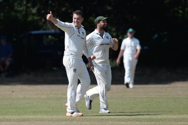 Tom Kitcher, left, gives the thumbs up after taking an Easton and Martyr Worthy wicket. Picture: Neil Marshall.