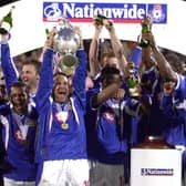 Paul Merson lifts the Division One trophy after Pompey claimed the title in 2002-03. Picture: Steve Reid