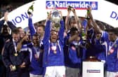 Paul Merson lifts the Division One trophy after Pompey claimed the title in 2002-03. Picture: Steve Reid