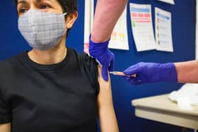 Woman getting a Covid 19 vaccine at a vaccination cente. Picture: Paul Maguire