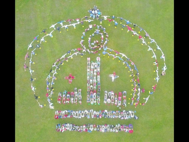 Youngsters at Queens Inclosure Primary School in Waterlooville form a crown