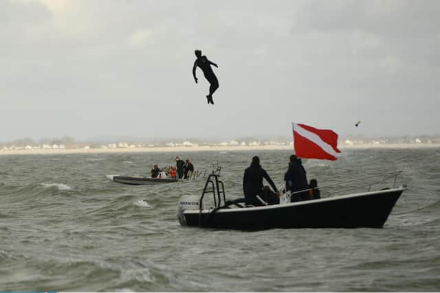 John Bream about to land in the water after jumping from the aircraft
Picture: Ewan Galvin/Solent News & Photo