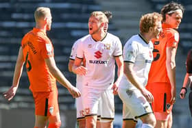 MK Dons substitute Charlie Brown confronts Jack Whatmough following the challenge which saw the Pompey defender sent off.