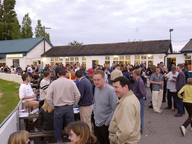 Punters enjoying a pint and a bite as they wait for the start of the next dog race at Tipner stadium. Picture: Mike Scaddan. 012884_0152