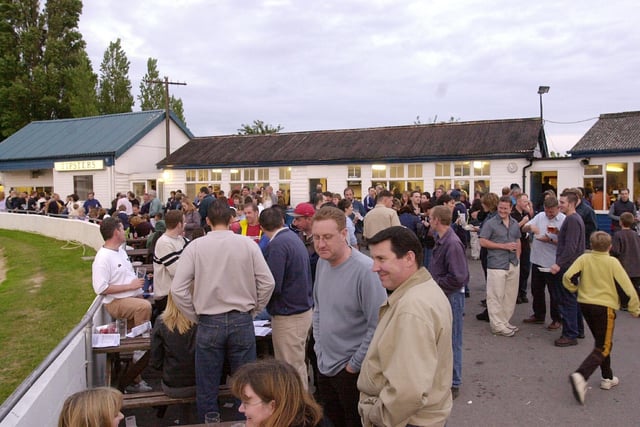 Punters enjoying a pint and a bite as they wait for the start of the next dog race at Tipner stadium. Picture: Mike Scaddan. 012884_0152