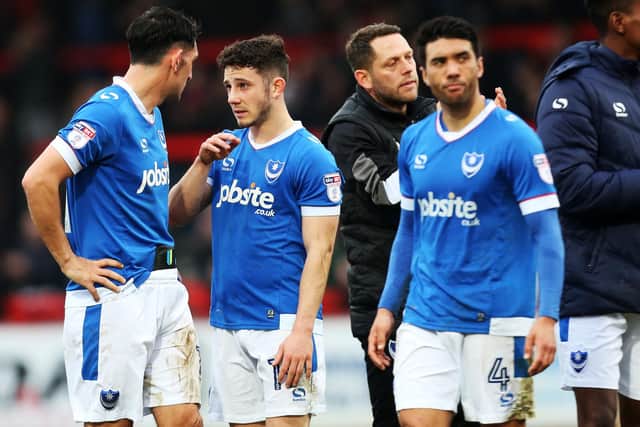 Conor Chaplin, centre, talks to team-mate Gary Roberts at the final whistle at the Lamex Satadium
